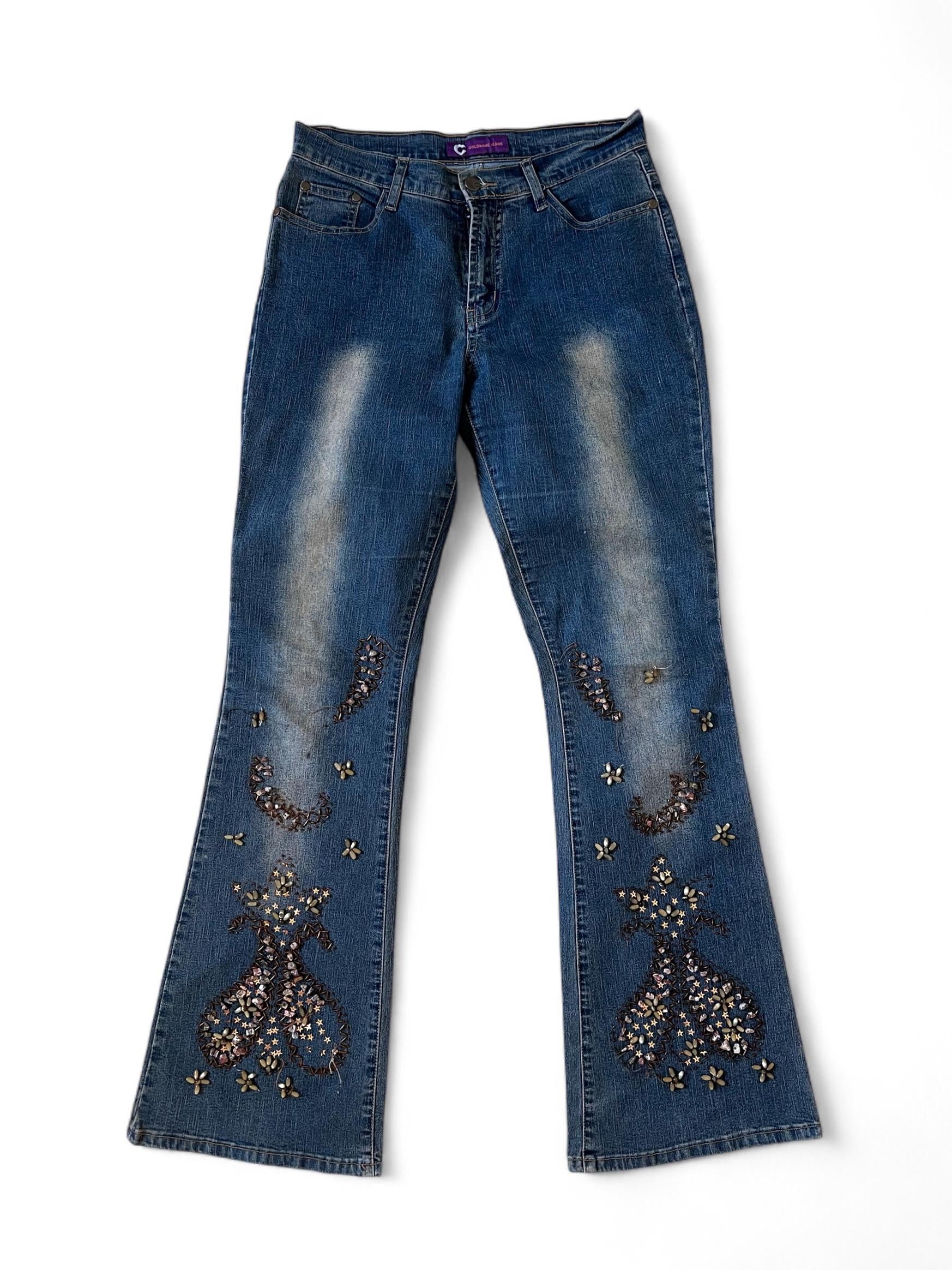Jeans con gambe ricamate con pietre e perline