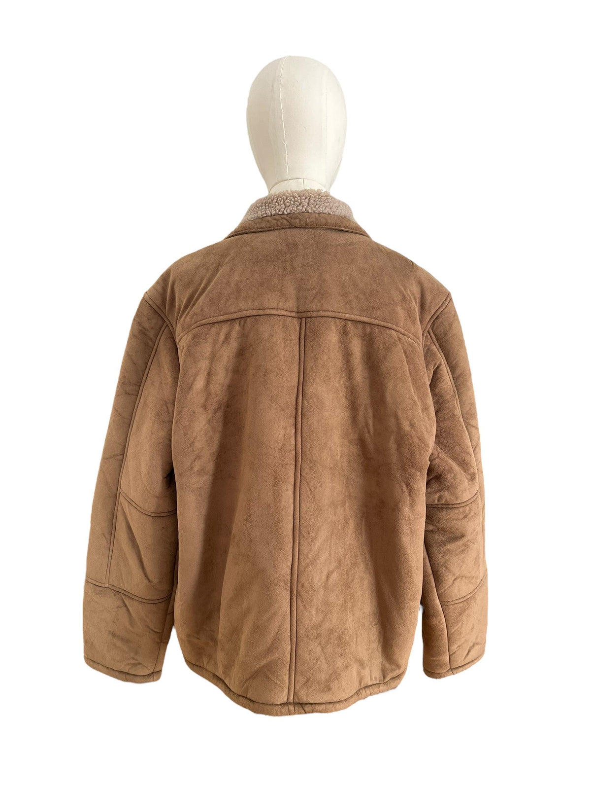 Shearling / Montone color marrone, zip frontale metallica e tasche arrotondate sul davanti
