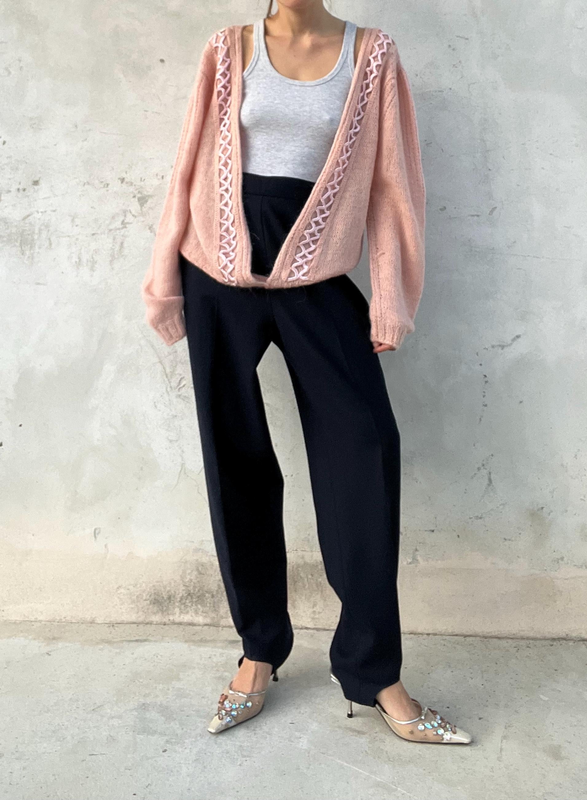 Cardigan vintage rosa con intreccio