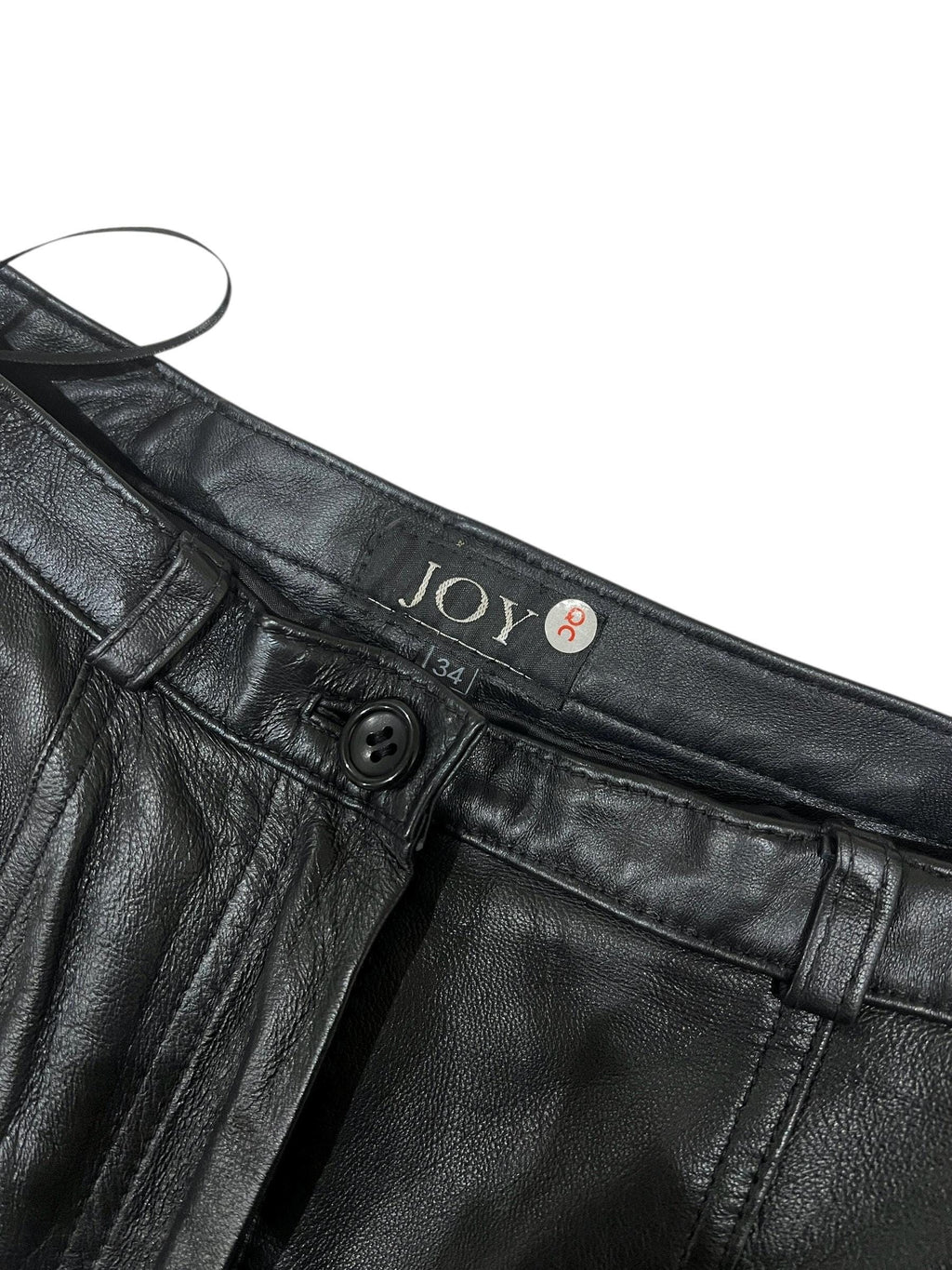Pantaloni di pelle a vita alta dalla linea affusolata con tasche zip metalliche sul davanti