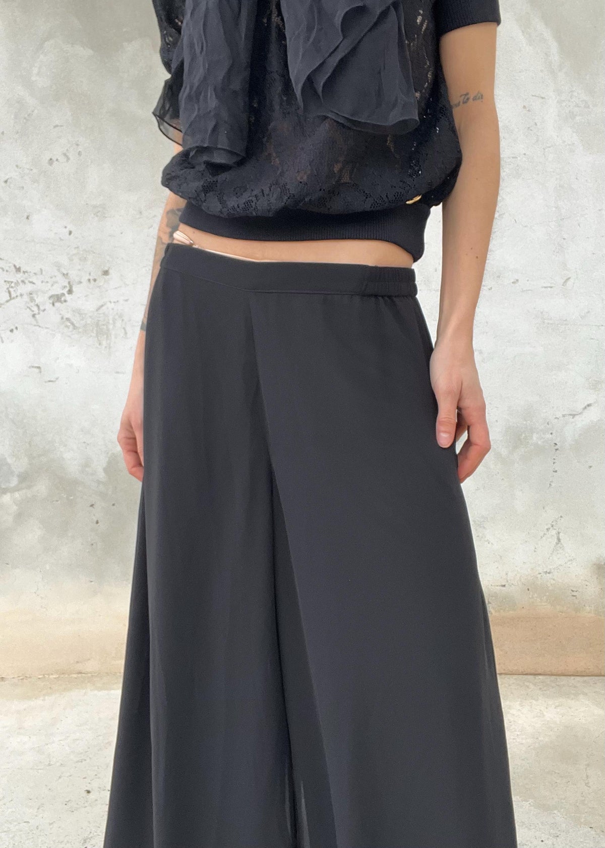 Pantaloni palazzo neri vintage fluidi a vita alta